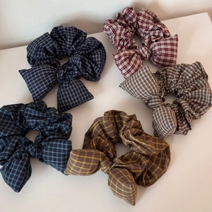 Detailed set of five plaid bow scrunchies in navy, burgundy, khaki, green, and yellow
