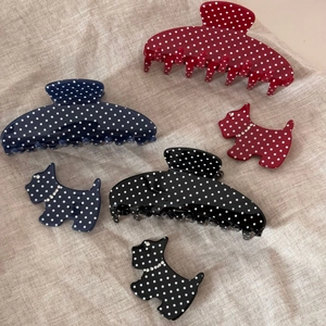 Polka dot hair claw set with fan-shaped and dog-shaped clips in red, blue, and black