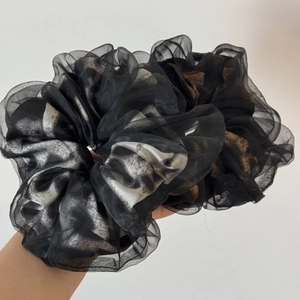 Close-up of double-layered leopard print organza scrunchies showing texture and volume
