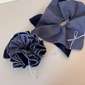 Detailed view of the vintage blue plaid bow scrunchie and textile hair accessory set