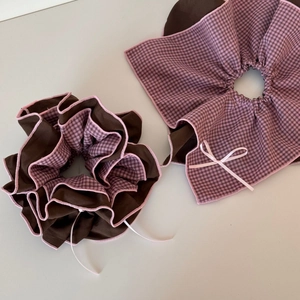 Detail of vintage brown and pink plaid scrunchie set with bow and ruffled edges