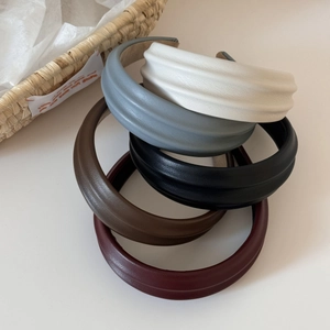 Five-color set of PU leather headbands with wide pleated texture on white background