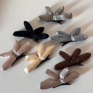 Detailed collection of 3D padded satin bow hair clips in multiple neutral colors