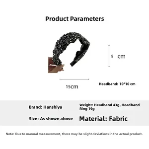 Detail shot of black velvet headband decorated with silver rhinestones and crystal accents