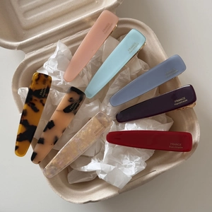 Detailed set of 7 assorted acetate hair clips with France Handmade text in a gift box