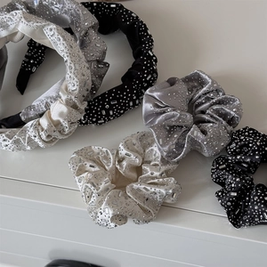 Detailed view of luxury velvet hairbands with handcrafted rhinestones in various colors