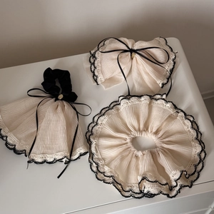 Elegant beige silk bow hair clip and lace scrunchie set with black trim for women