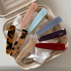 Handmade acetate hair clips in various colors and tortoiseshell textures for women