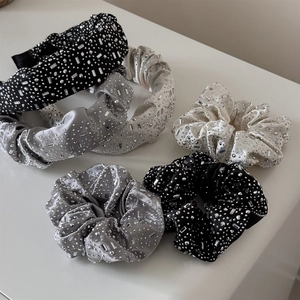 Luxurious velvet scrunchies and headbands set with heavy sparkling rhinestones