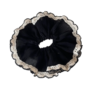 Elegant black scrunchie hair tie with white lace edges and sweet vintage design