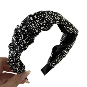 Luxurious black velvet headband with sparkling crystal rhinestones and wide knot design