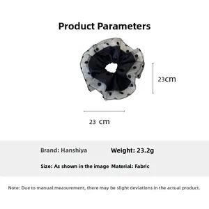 Detail view of large black polka dot organza scrunchie with 23cm diameter and 23.2g weight