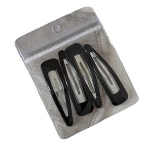 Set of 4 vintage black glossy triangular BB clips for hair styling in 45-degree angle view