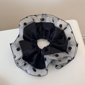 Large black polka dot organza scrunchie with satin inner layer and ruffled edge design