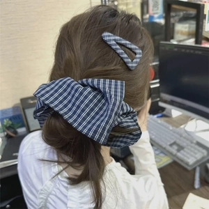 Navy blue gingham check oversized scrunchie and triangle hair clip set on a low ponytail