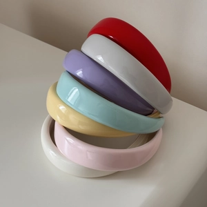 Close-up of colorful thick sponge headbands with glossy finish in various candy colors
