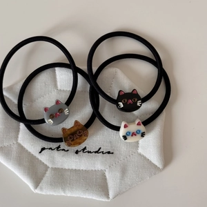 Set of four cute cartoon cat hair ties with high elastic black bands in various colors