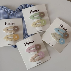 Cute set of 8 pieces of colorful floral hair clips for women on a card display