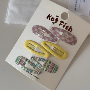 Detailed set of 6 wave-edged hair clips in pink and yellow checkered patterns