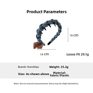 Detail showing blue denim braided headband with black inner teeth and size specifications