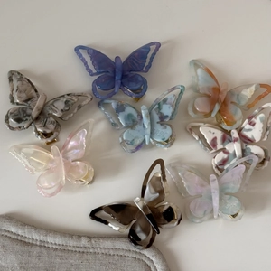 French iridescent acetate butterfly hair clips in multiple colors with hollow wings
