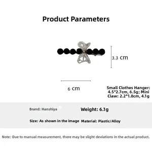 Detail view of a small beaded bow hair claw clip showing precise 6cm x 3.3cm measurements