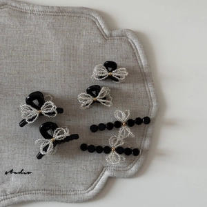 5-piece set of elegant black ribbon hair clips with white pearly bead bow accents