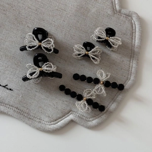 6-piece set of elegant black resin hair clips with beaded silver bows for women