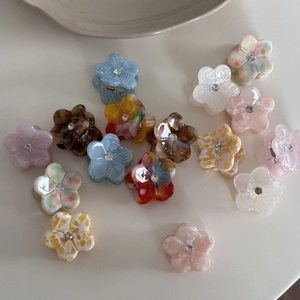 Mini pinces à cheveux à fleurs en acétate avec strass centraux et motifs colorés variés