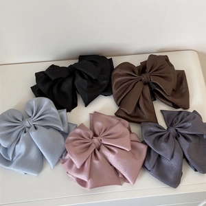Detailed set of multi-layered satin bow hair clips in five elegant assorted colors