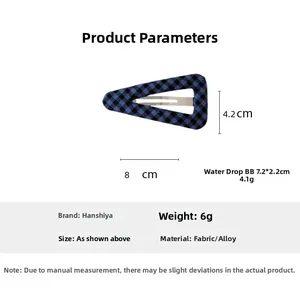 Detail showing 8cm blue and black plaid fabric triangle hair clip with size dimensions