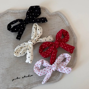 Lot de quatre barrettes nœuds à pois noirs, rouges et blancs sur tissu en lin naturel