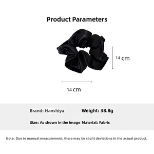 Detailed specs of black satin ruffle scrunchie measuring 14cm x 14cm and weighing 38.8g