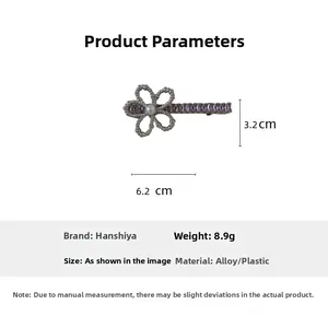 Detail view of purple flower hair clip with pearls and rhinestones measuring 6.2cm
