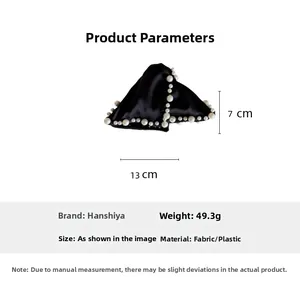 Detailed view of black satin bow hair claw with pearls and 13cm size parameter dimensions