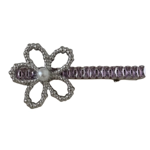 Floral silver hair clip with white pearl and purple crystals on a clean white backdrop
