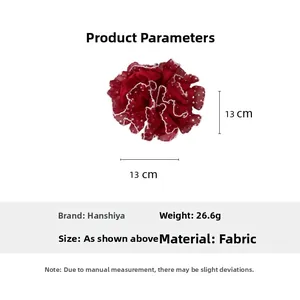 Tableau des tailles du chouchou rouge à pois montrant un diamètre de 13cm et une matière tissu