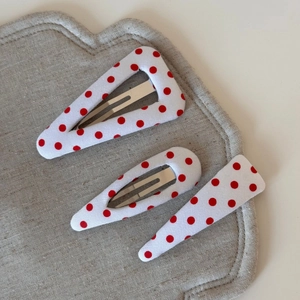Three-piece red polka dot hair clip set with geometric triangle and waterdrop shapes