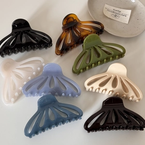 Elegant hollow fan-shaped hair claws in 8 diverse colors with a glossy finish