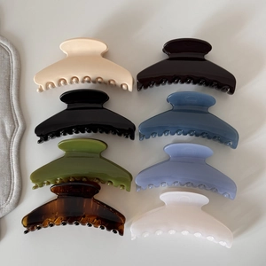 Set of eight elegant large arc hair claws in assorted colors for sophisticated styling