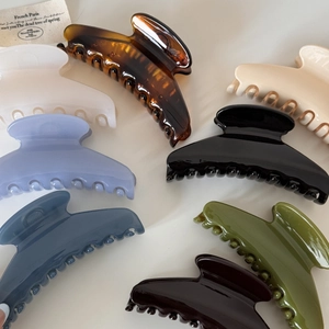 Glossy large hair claw clips in multiple colors for elegant updo hairstyling