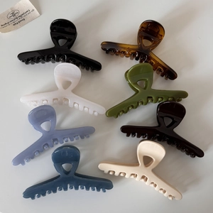 Elegant glossy cross hair claw clips set in eight assorted colors for classic updos