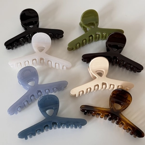 Elegant glossy cross hair claw clips set in various colors for stylish women hair styling