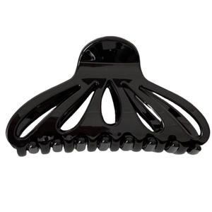 Elegant glossy black fan-shaped hollow hair claw clip with a minimalist geometric design
