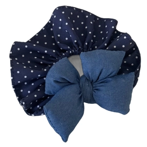 Blue denim texture bow hair scrunchie with white polka dot pattern on a white background