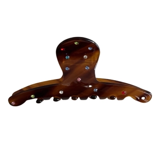 Amber acetate hair claw clip with colorful rhinestones and tortoiseshell texture pattern