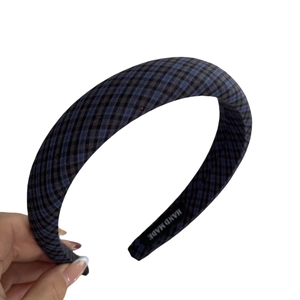 Blue and black plaid sponge headband with padded texture for retro high top hair styling