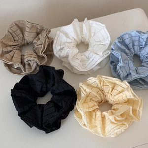 Five-piece set of striped mesh scrunchies in cream, white, blue, black, and yellow