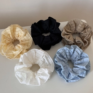 Five translucent striped scrunchies in yellow, black, brown, white and blue for women