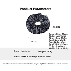 Detail view of navy paisley scrunchie showing 19cm diameter and lightweight fabric